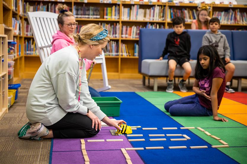 Students use Bee-Bots in the Learning Commons